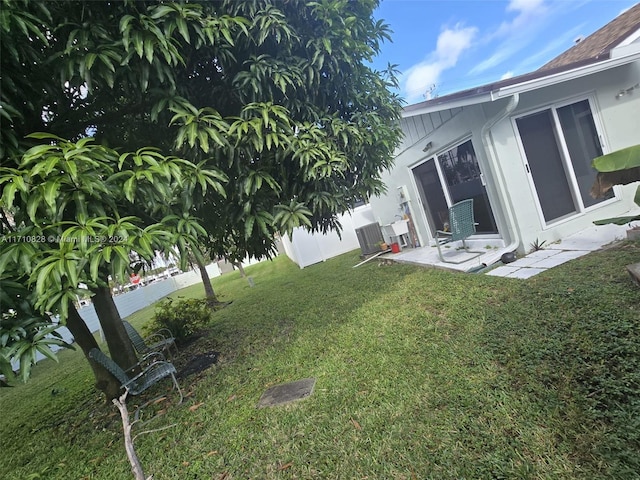 view of yard featuring central AC