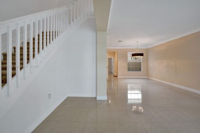 stairway featuring crown molding, tile patterned flooring, baseboards, and an inviting chandelier