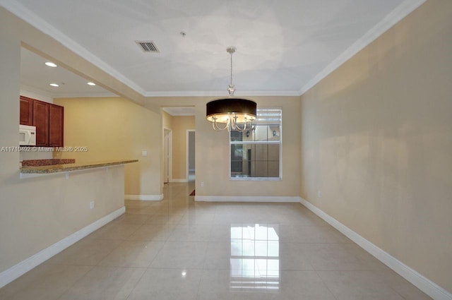 unfurnished dining area featuring light tile patterned flooring, an inviting chandelier, baseboards, ornamental molding, and visible vents