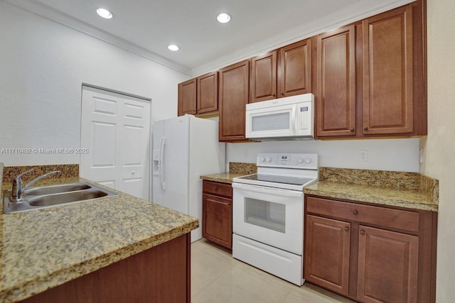 kitchen with a sink, recessed lighting, white appliances, crown molding, and light tile patterned floors