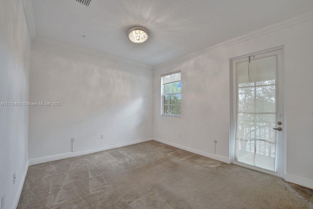 unfurnished room with carpet, baseboards, and ornamental molding