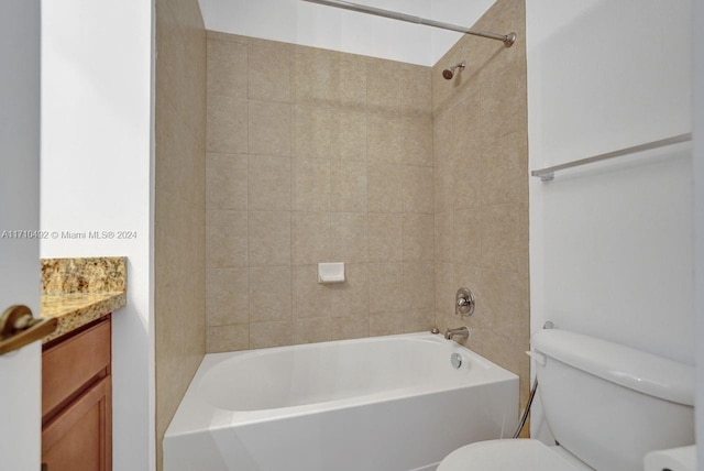 full bathroom featuring vanity, toilet, and tiled shower / bath combo