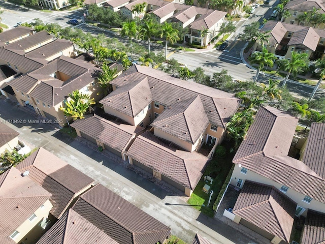 birds eye view of property with a residential view