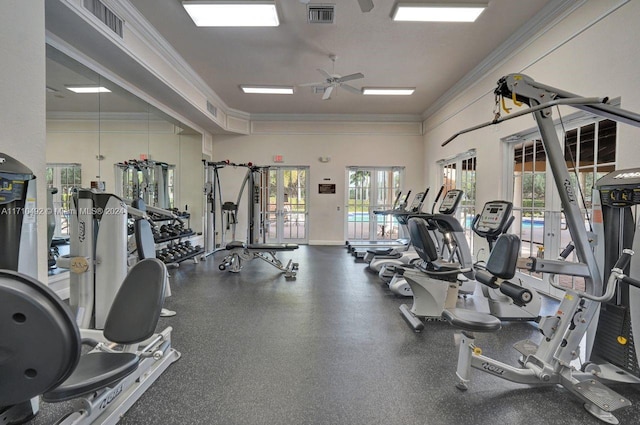 exercise room with ornamental molding, ceiling fan, and a healthy amount of sunlight