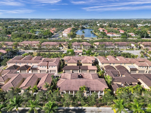 bird's eye view featuring a residential view and a water view