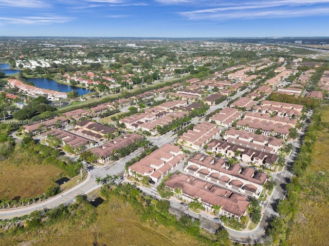 bird's eye view featuring a residential view and a water view