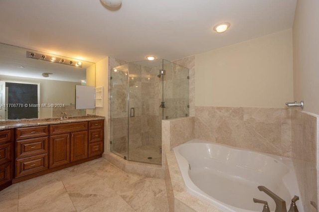 bathroom featuring shower with separate bathtub and vanity