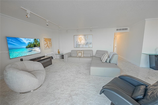 carpeted living room featuring a textured ceiling, crown molding, and track lighting