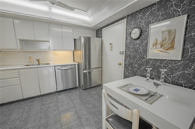 kitchen featuring white cabinets, sink, and stainless steel appliances