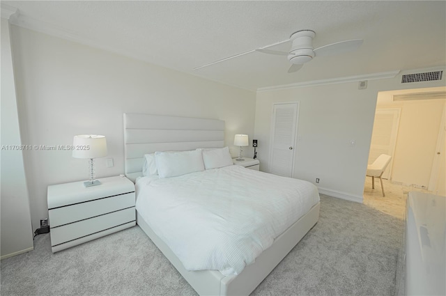 bedroom with light carpet, a closet, and ceiling fan