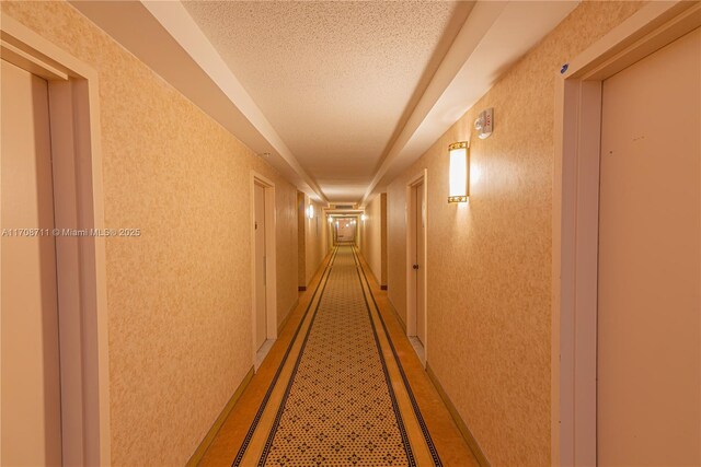 corridor with a textured ceiling