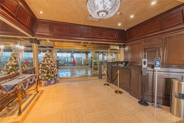 interior space featuring an inviting chandelier and wooden walls