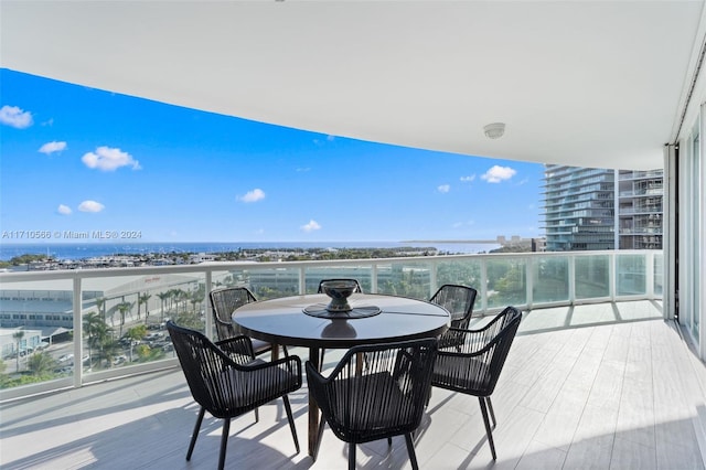 balcony featuring a water view