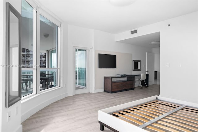 bedroom with light hardwood / wood-style floors