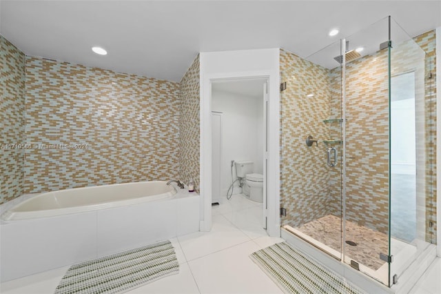 bathroom featuring tile patterned flooring, independent shower and bath, tile walls, and toilet