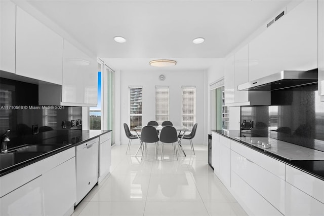 kitchen with white cabinetry and plenty of natural light