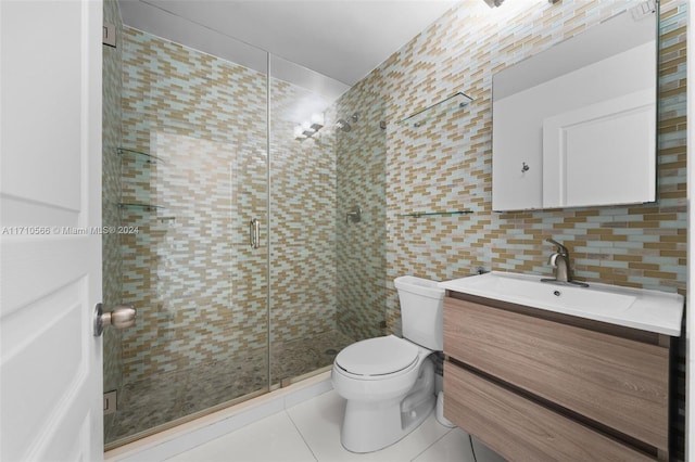 bathroom with tile patterned floors, an enclosed shower, tile walls, and tasteful backsplash