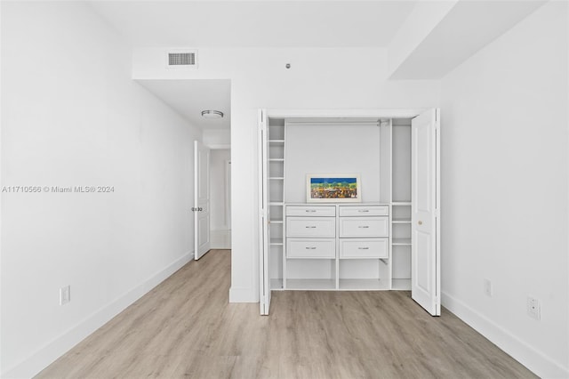 unfurnished bedroom with light hardwood / wood-style floors