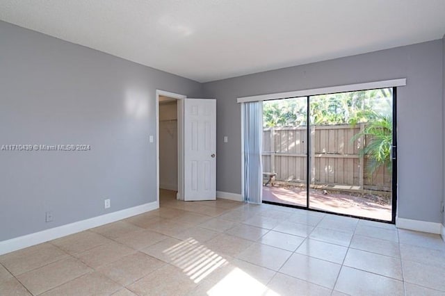 spare room with light tile patterned floors