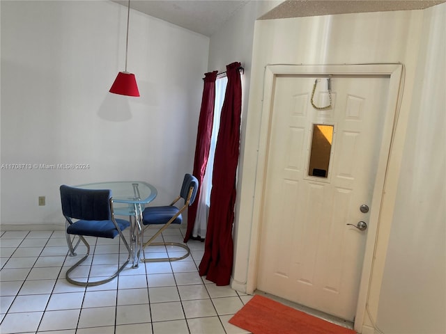 foyer entrance with light tile patterned flooring