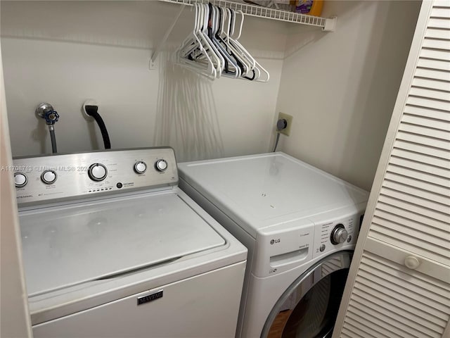 laundry room featuring separate washer and dryer