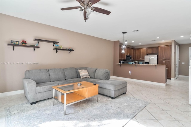 tiled living room featuring ceiling fan