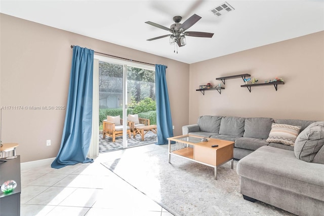 living room featuring light tile patterned floors and ceiling fan