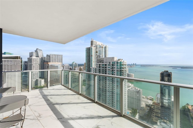 balcony featuring a water view