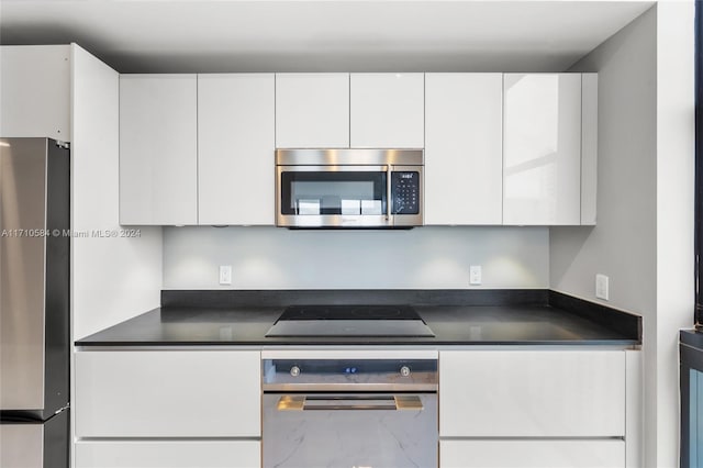 kitchen featuring white cabinetry and stainless steel appliances