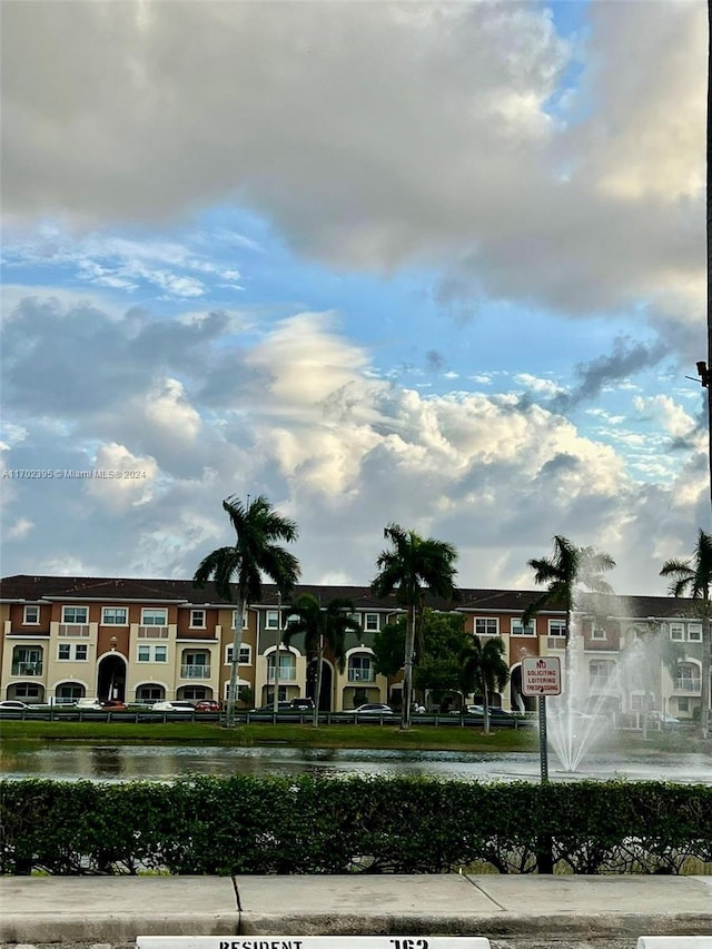 view of community with a water view