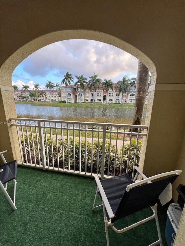 balcony featuring a water view