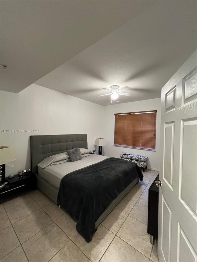 bedroom featuring ceiling fan and light tile patterned floors