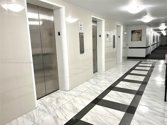 hallway featuring elevator