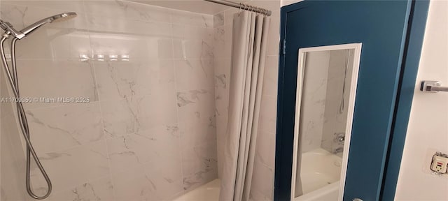 bathroom with shower / tub combo with curtain