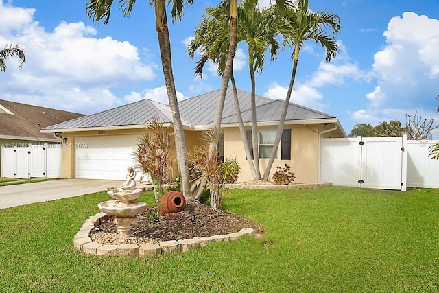 single story home with a garage and a front lawn