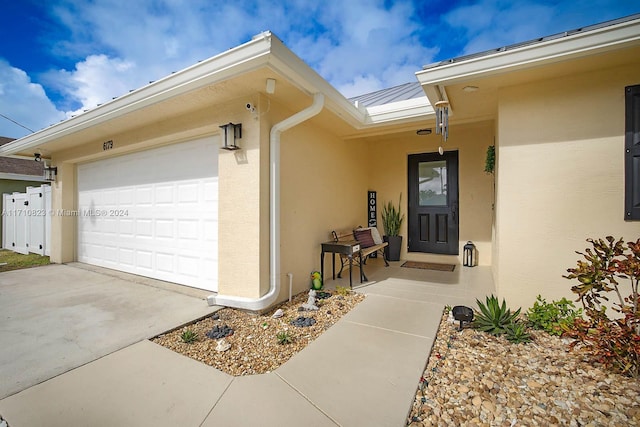 entrance to property featuring a garage