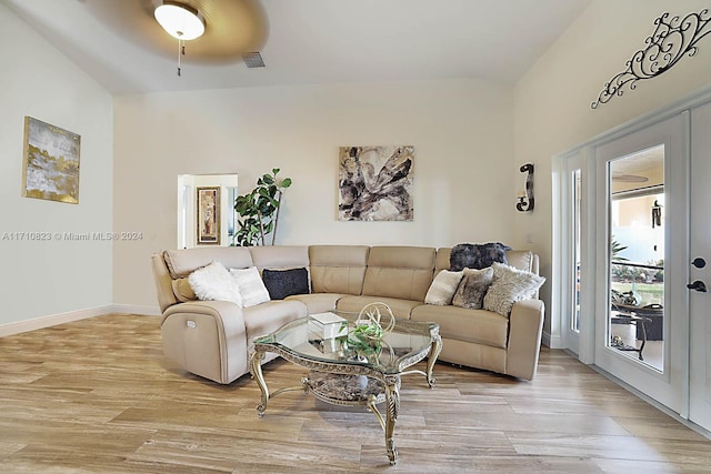 living room featuring ceiling fan and light wood-type flooring