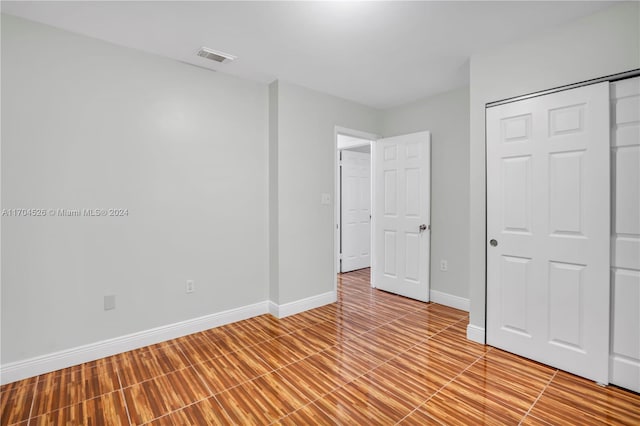 unfurnished bedroom with a closet