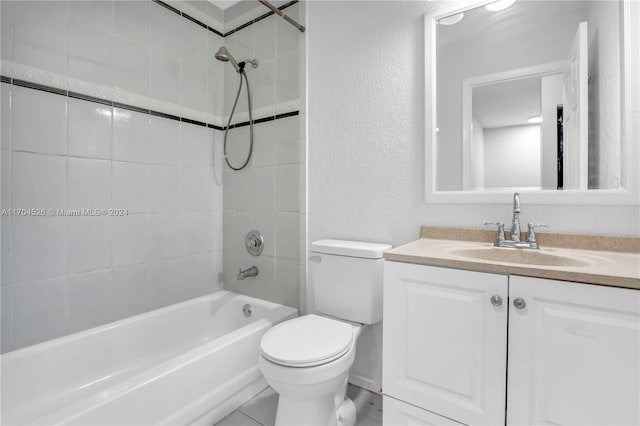 full bathroom with vanity, toilet, and tiled shower / bath combo