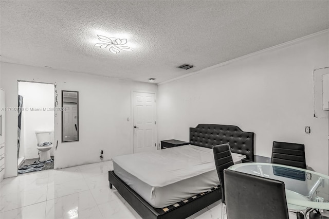 bedroom with a textured ceiling and crown molding