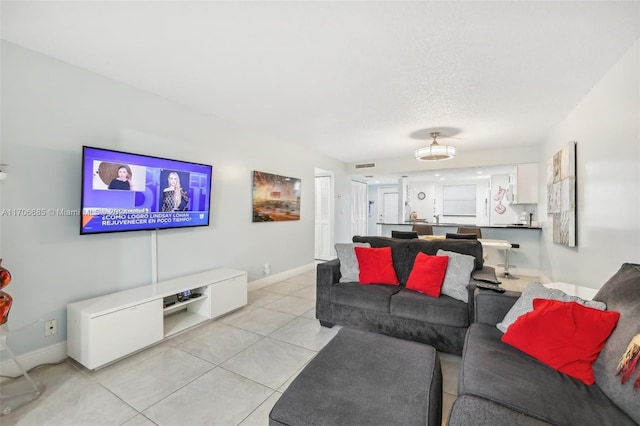 living room featuring light tile patterned flooring