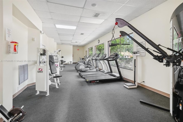 gym featuring a paneled ceiling