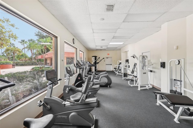 workout area featuring a drop ceiling