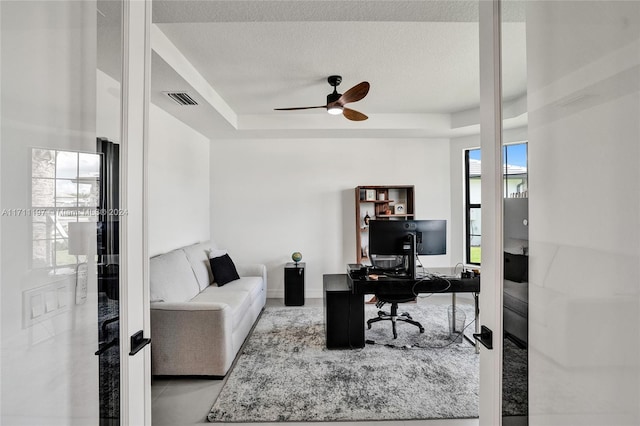 4536 N Silverwood Ln N, Oakland Park, FL 33309 - office featuring a textured ceiling, ceiling fan, visible vents, and a raised ceiling