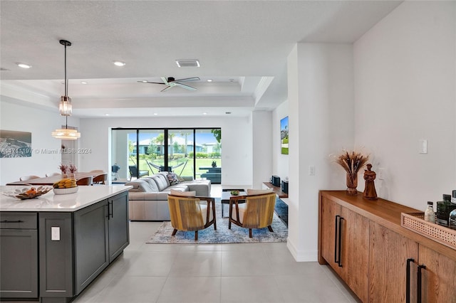 4536 N Silverwood Ln N, Oakland Park, FL 33309 - kitchen with light countertops, visible vents, recessed lighting, gray cabinetry, and a tray ceiling