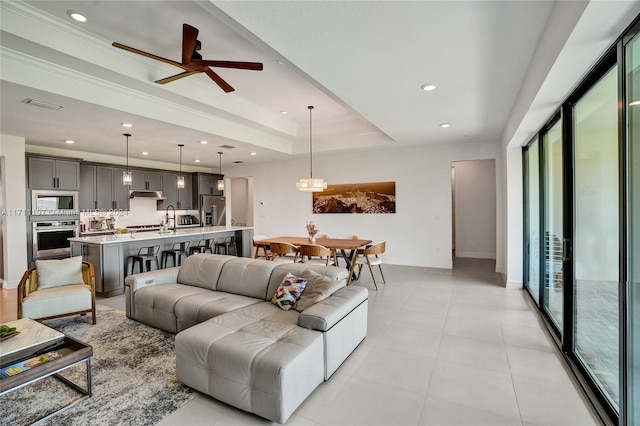 4536 N Silverwood Ln N, Oakland Park, FL 33309 - living room with a wealth of natural light, ceiling fan, recessed lighting, and a raised ceiling