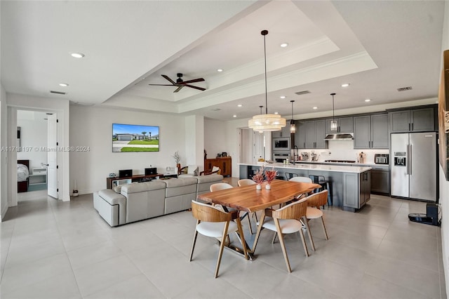 4536 N Silverwood Ln N, Oakland Park, FL 33309 - dining space with visible vents, crown molding, ceiling fan, and a raised ceiling