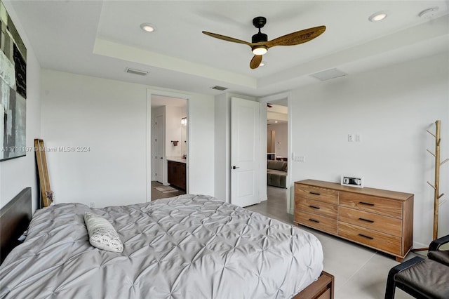 4536 N Silverwood Ln N, Oakland Park, FL 33309 - bedroom with a tray ceiling, visible vents, and recessed lighting