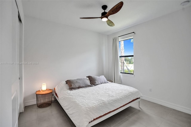 4536 N Silverwood Ln N, Oakland Park, FL 33309 - bedroom featuring baseboards, a closet, ceiling fan, and light tile patterned floors
