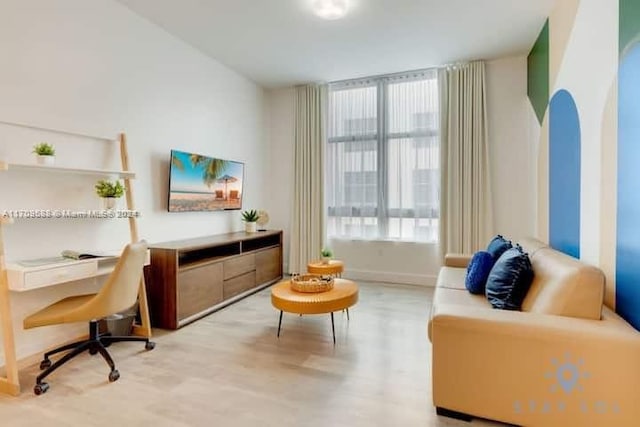 sitting room featuring light hardwood / wood-style floors